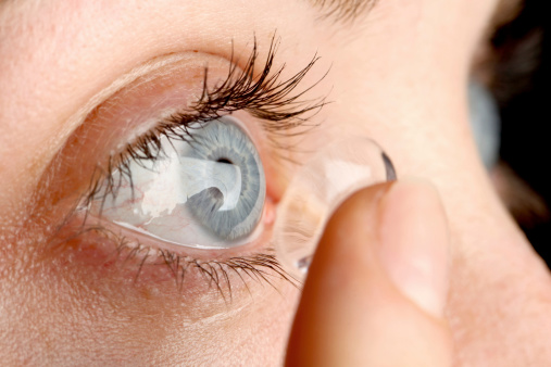 Contact lens being applied to an eye